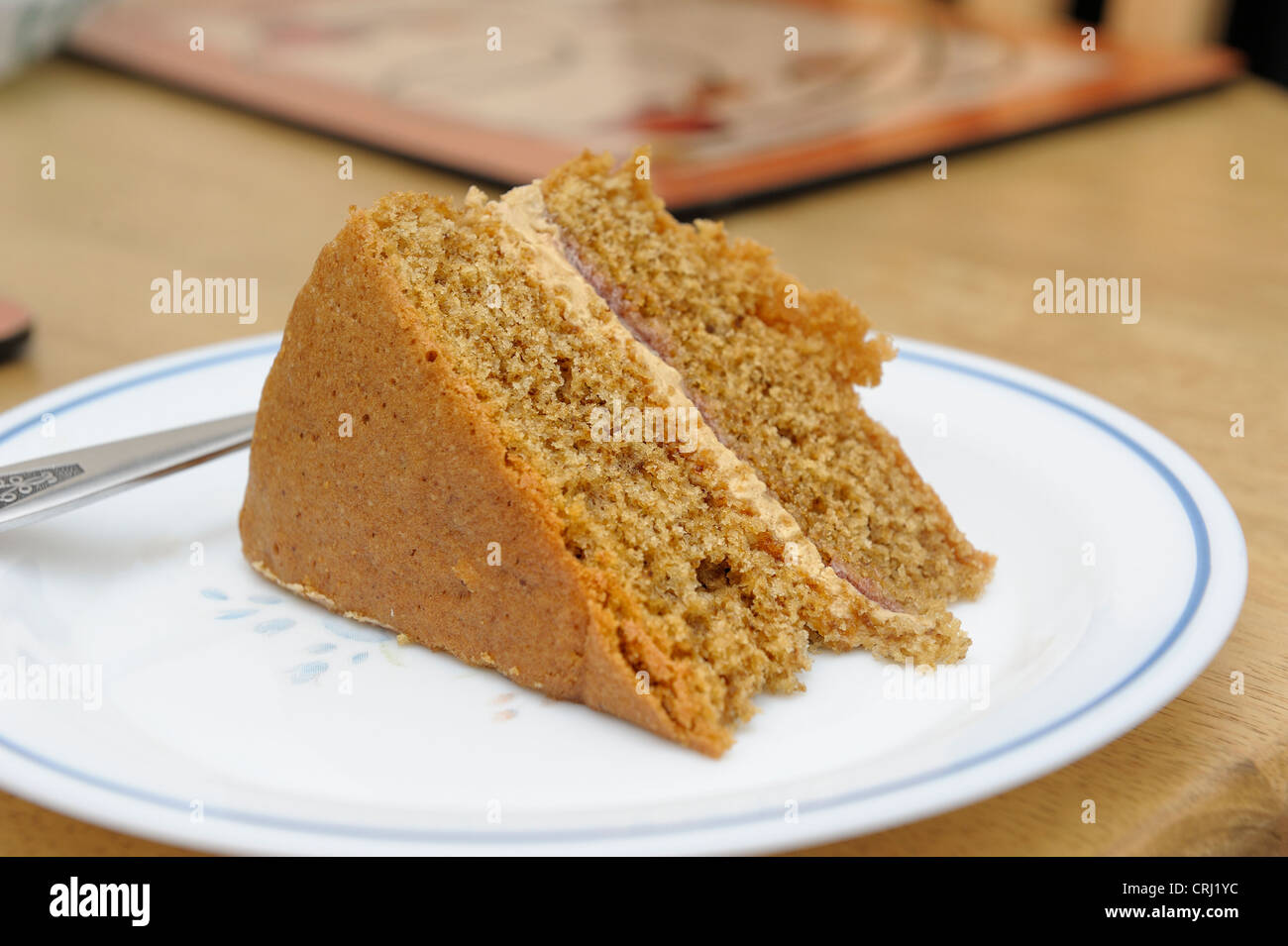 homemade coffee cream sponge cake on a plate Stock Photo