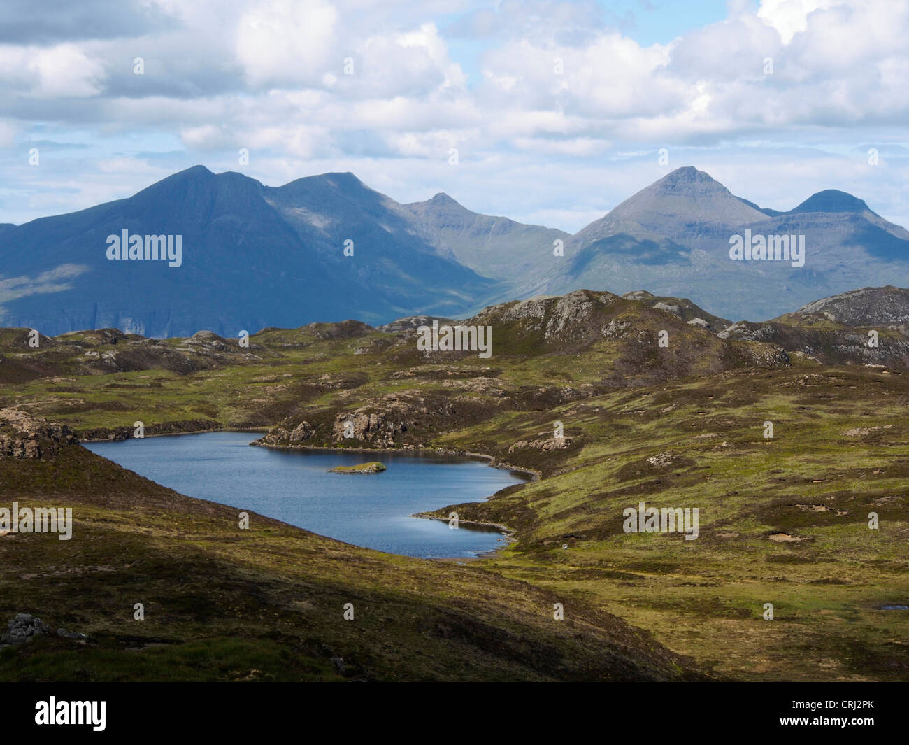 Peaks of Rum Cuillin from An Sgurr, Eigg, Scotland Stock Photo