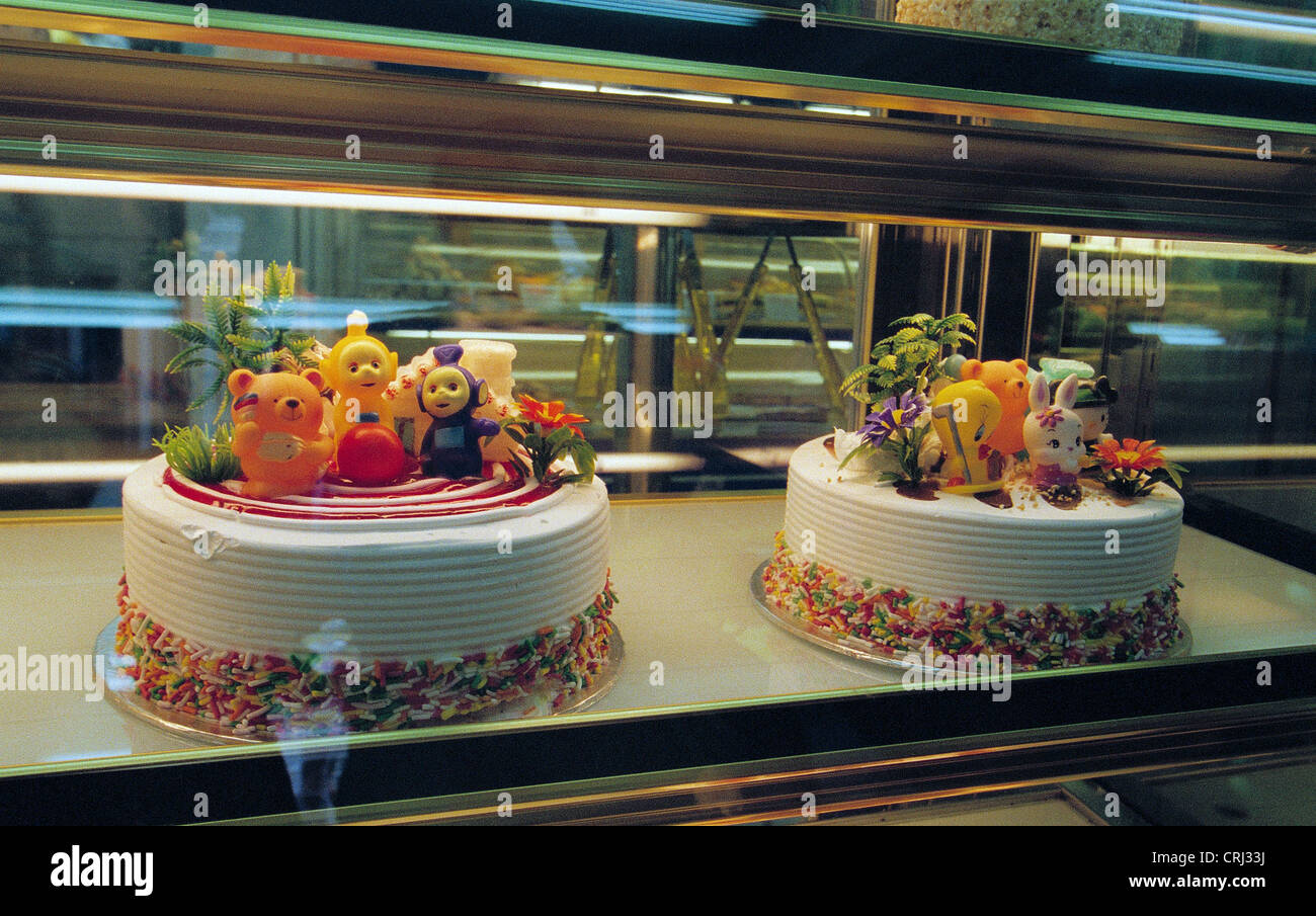 Cakes with Teletubbies as decoration in the display case of a pastry shop in Singapore Stock Photo