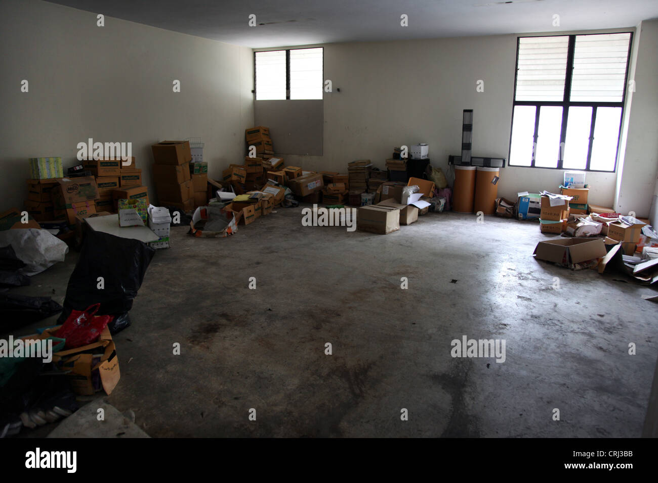 It's a photo of an abandoned room or office full of rubbish or trash