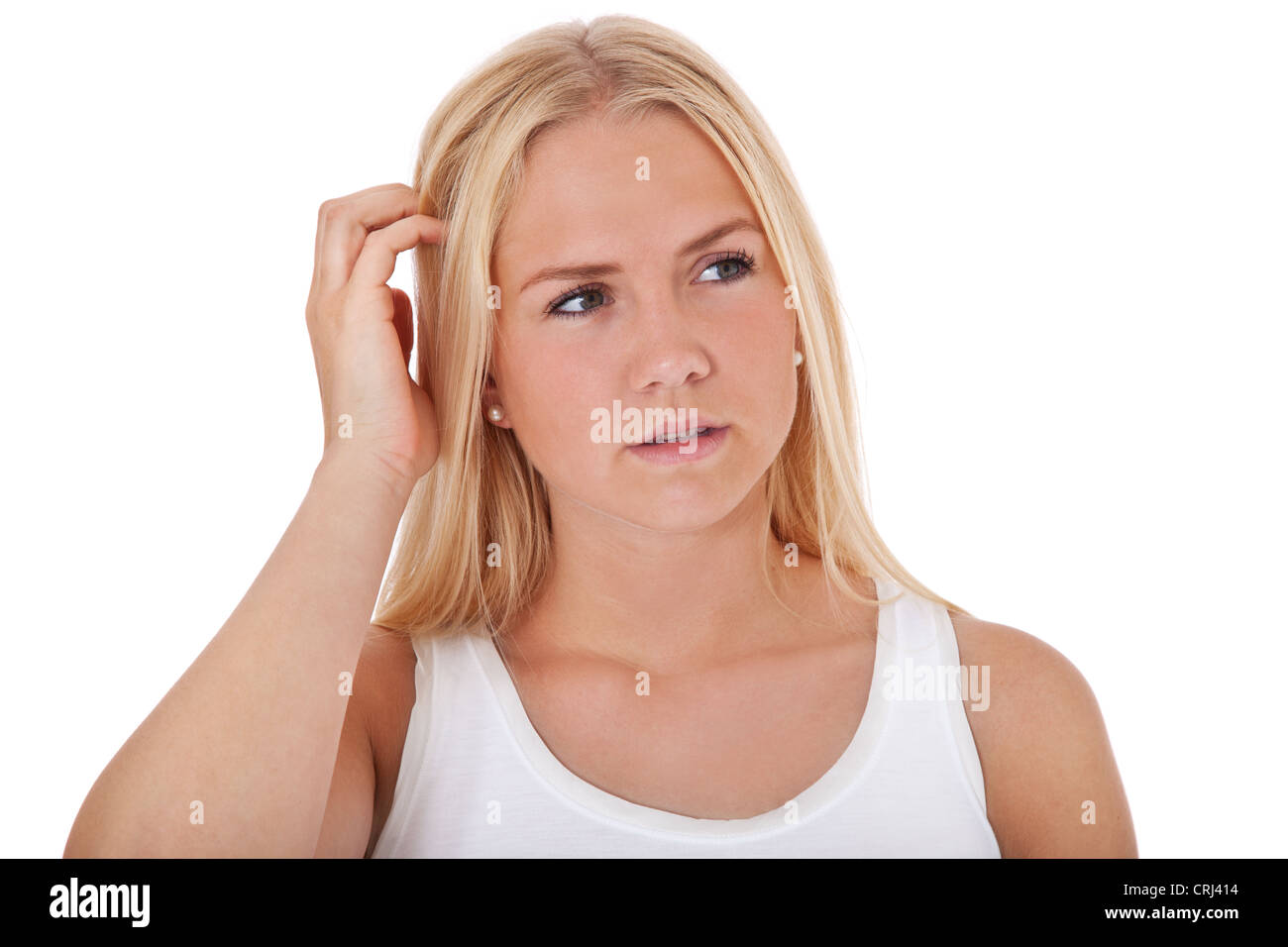 Attractive teenage girl deliberates a decision. All on white background. Stock Photo