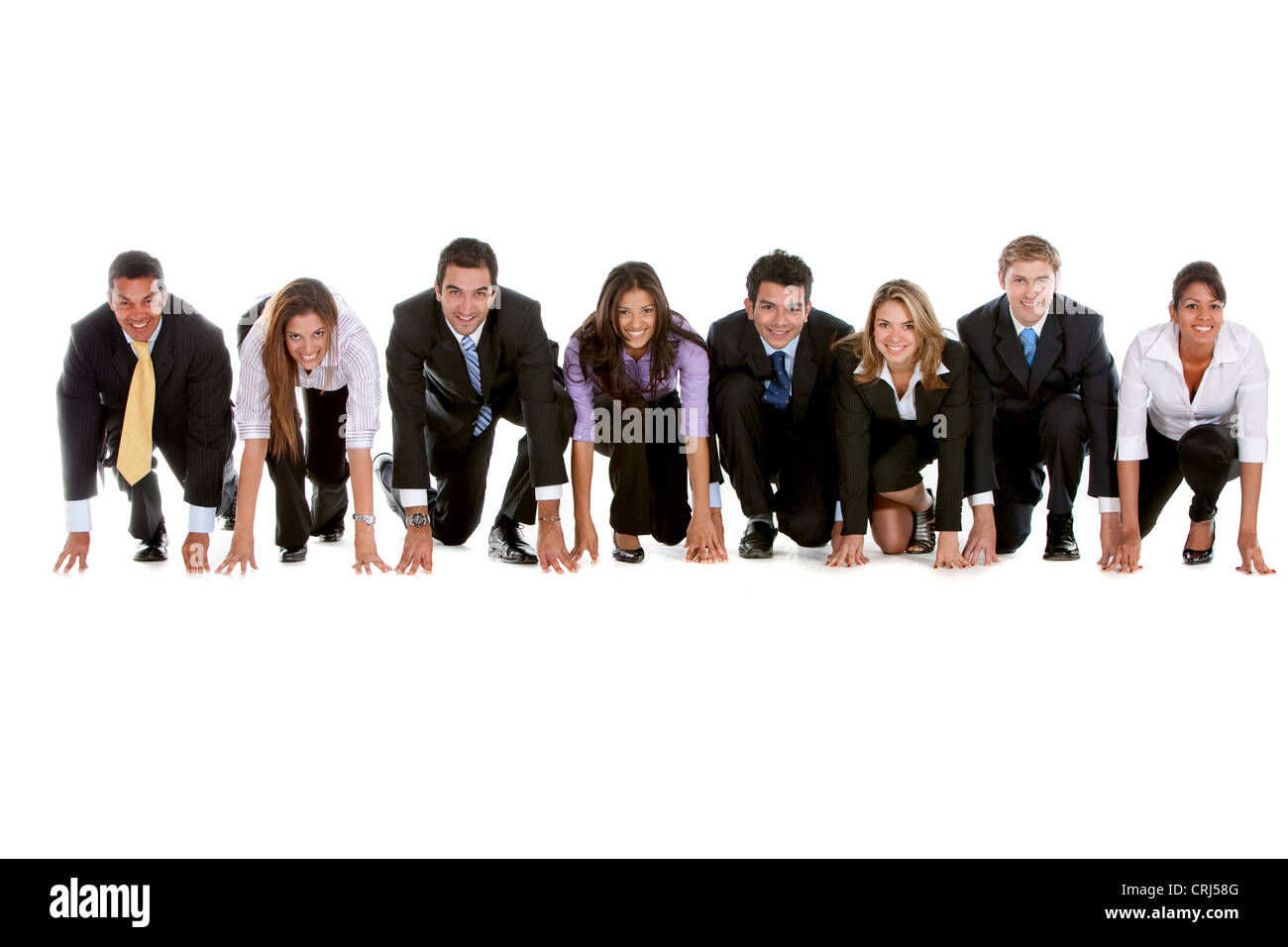 8 young business people in a row in starting position for a race Stock Photo