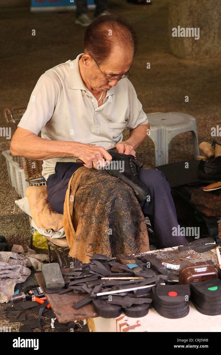 Street cobbler hires stock photography and images Alamy