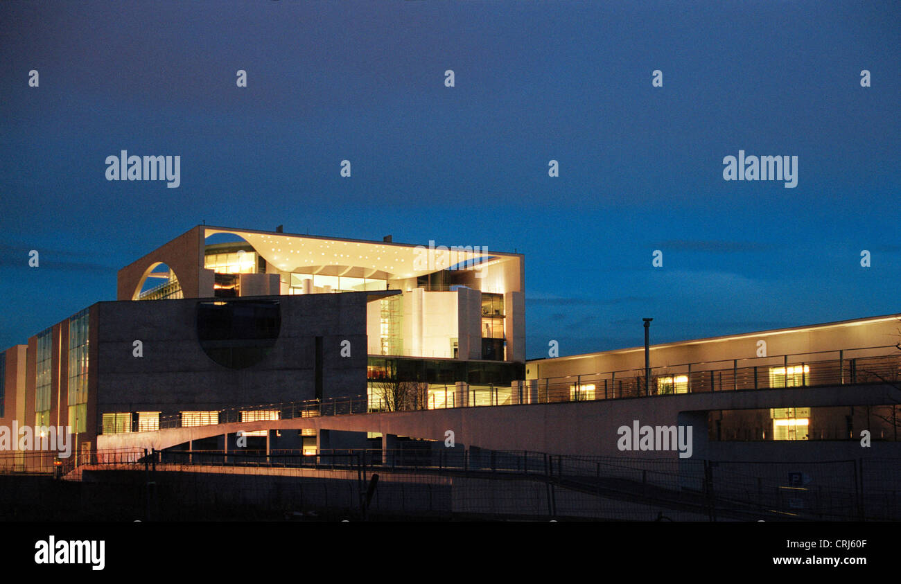 The brightly lit west side of the Federal Chancellery in the dusk Stock Photo