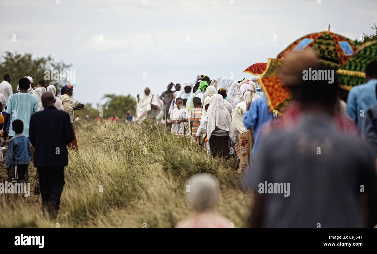 Group of people walking in a religious procession. Stock Photo