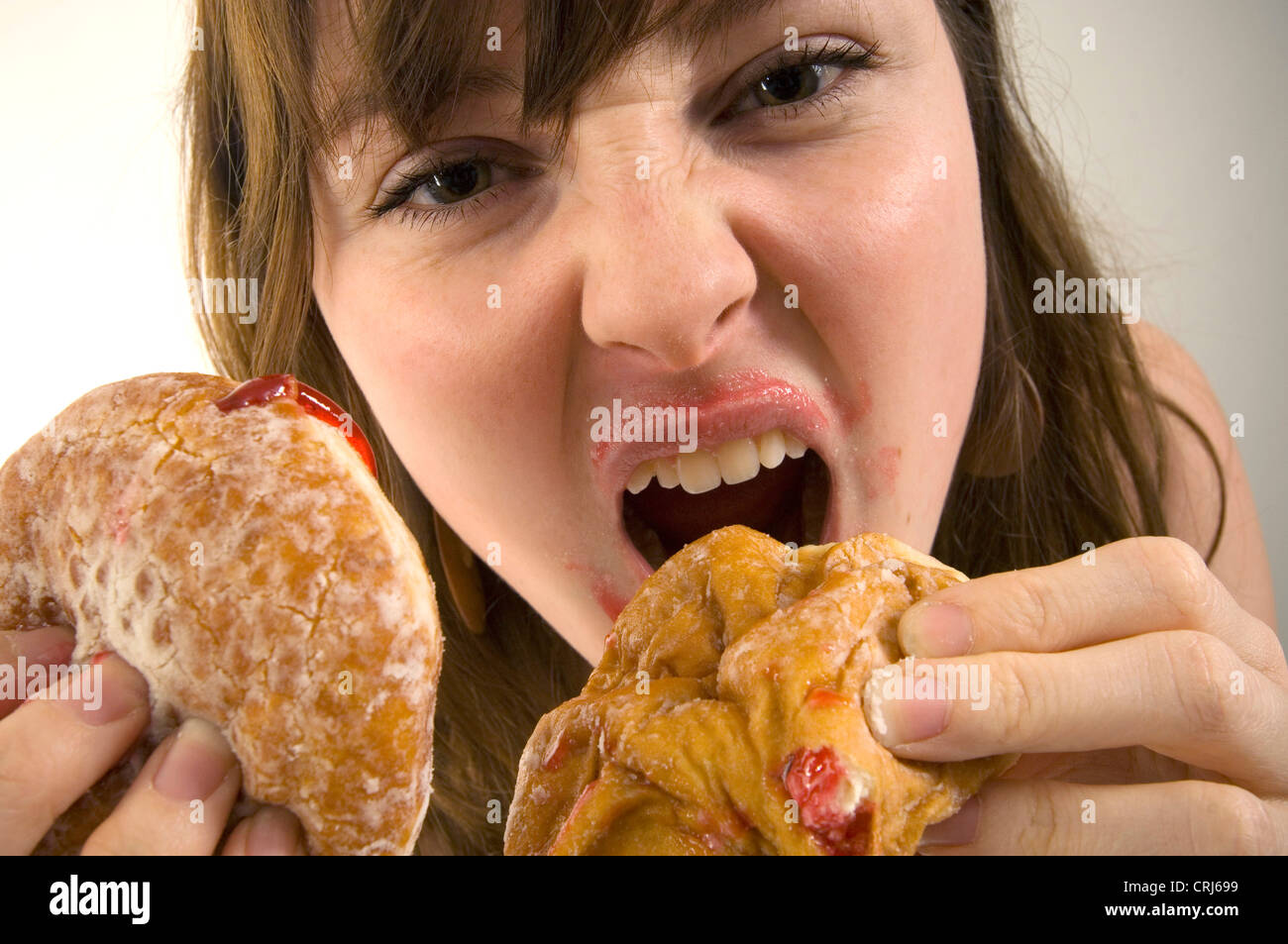 Stuffing food mouth hi-res stock photography and images - Alamy