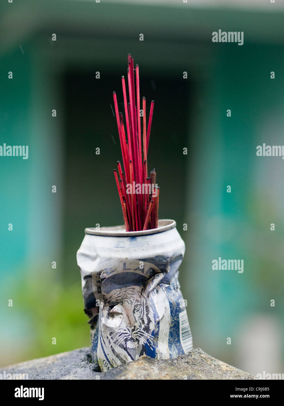 Incense sticks in can outside a house in Hoi An, Vietnam Stock Photo