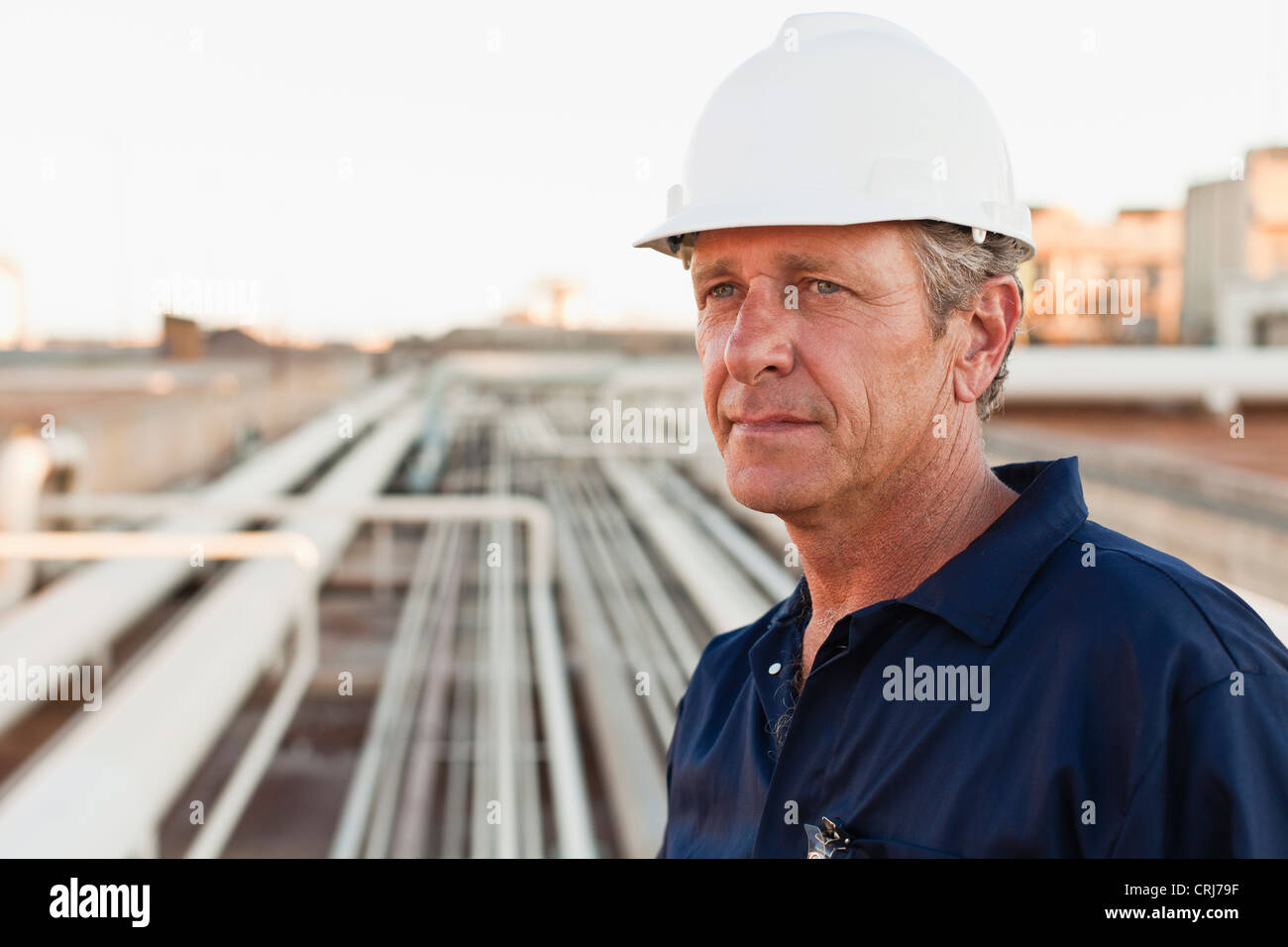 Close up of worker at oil refinery Stock Photo