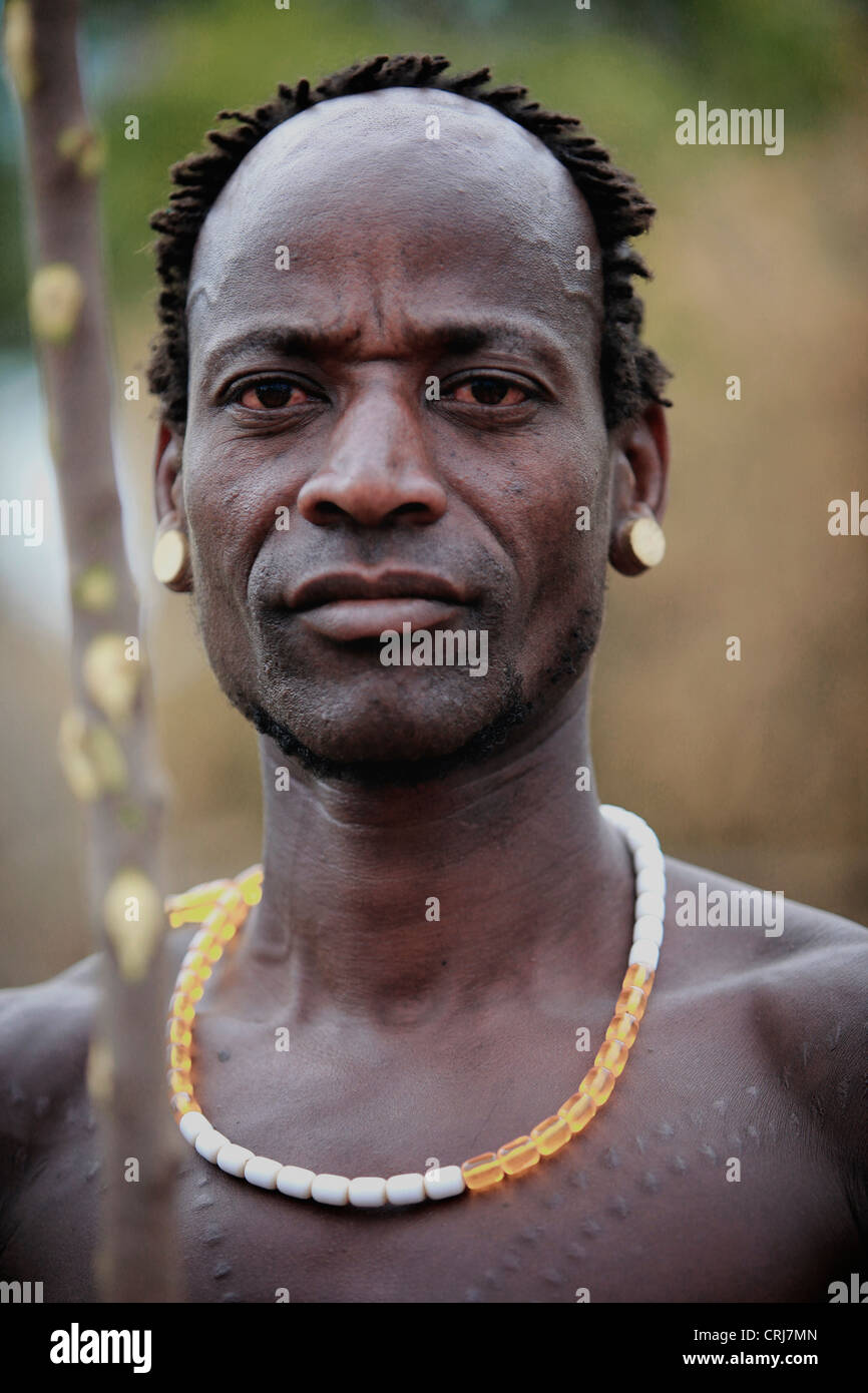 Bodi tribal man with traditional scarification on his chest. Stock Photo