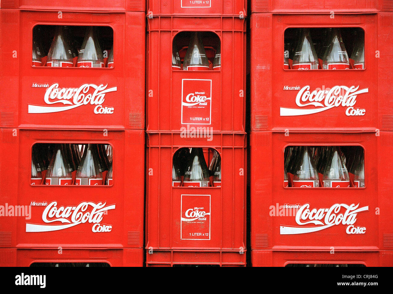 Coca-Cola crates with empty bottles and the Coca-Cola Indonesian logo Stock  Photo - Alamy