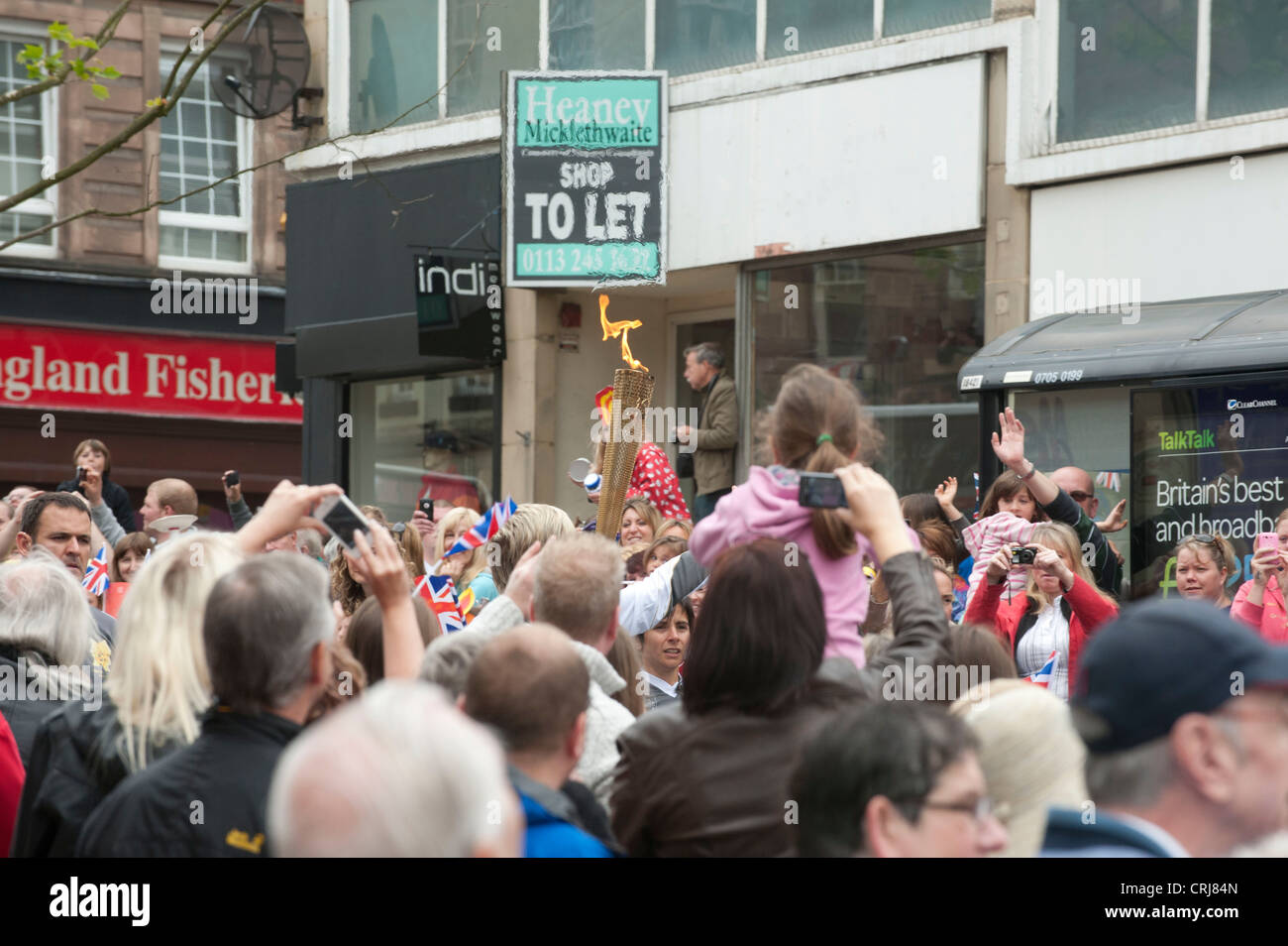 Olympic torch being carried through Wakefield by Jono Lancaster Stock