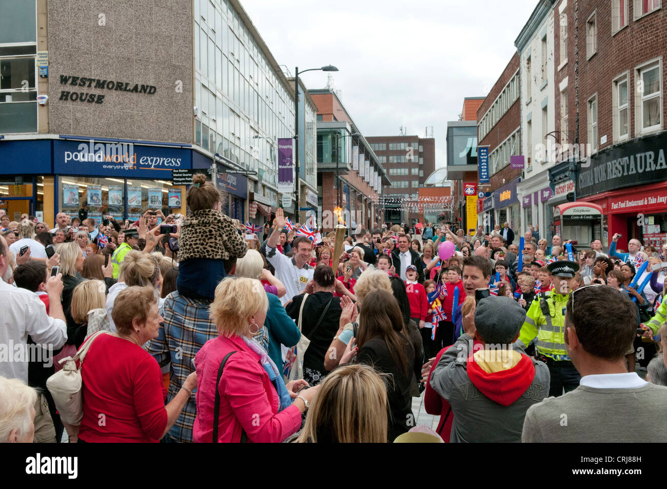 Olympic torch carried through Wakefield by Kieran Burke Stock Photo Alamy