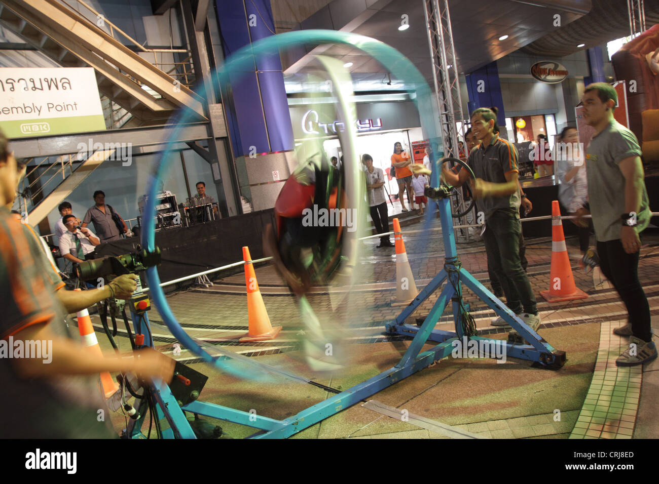 People riding on Space Roller in amusement park at MBK shopping mall in ...