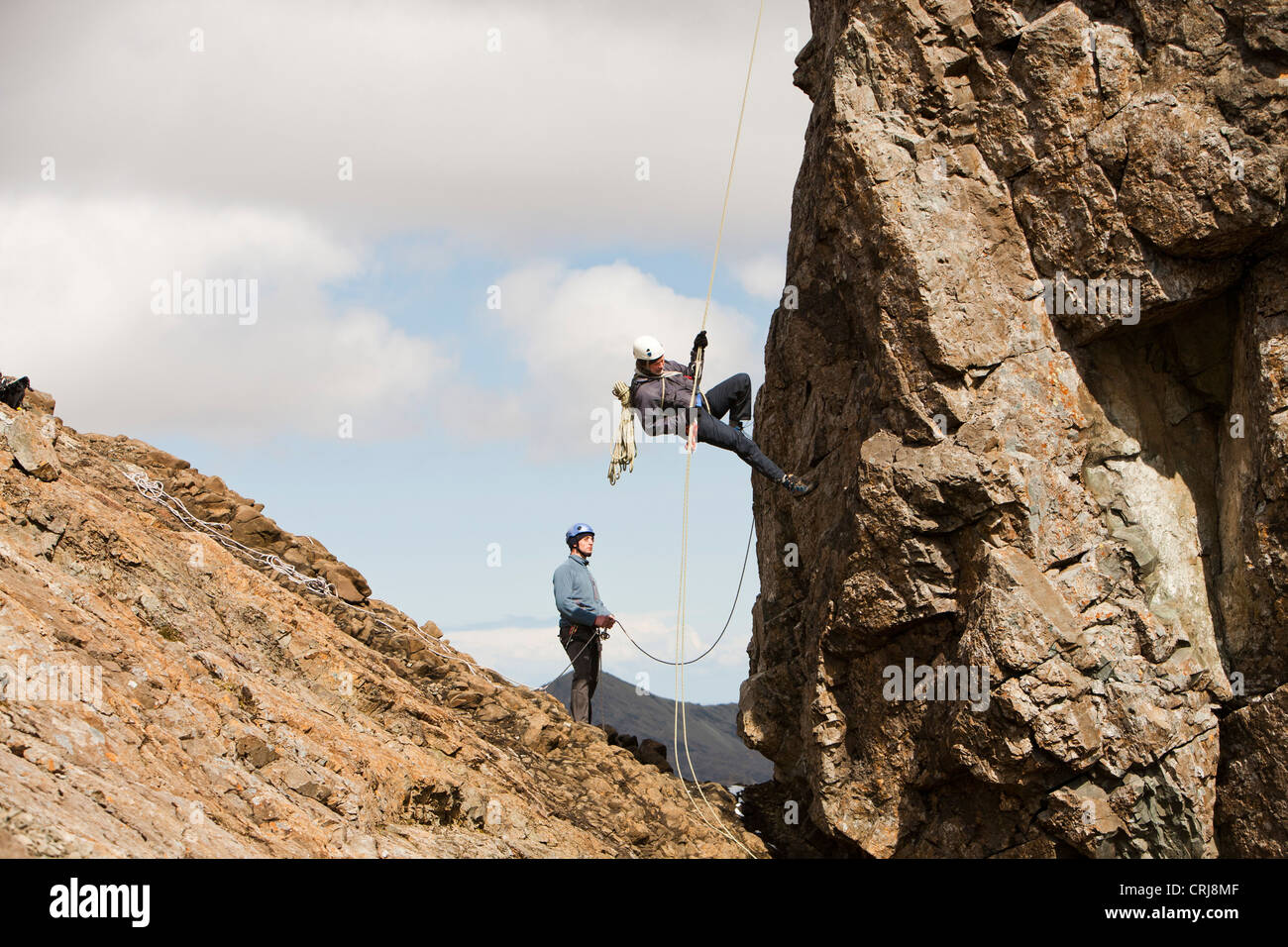 Climbers abseiling from the summit of the Inaccessible Pinnacle onto Sgurr Dearg in the Cuillin mountains, Isle of Skye, Stock Photo