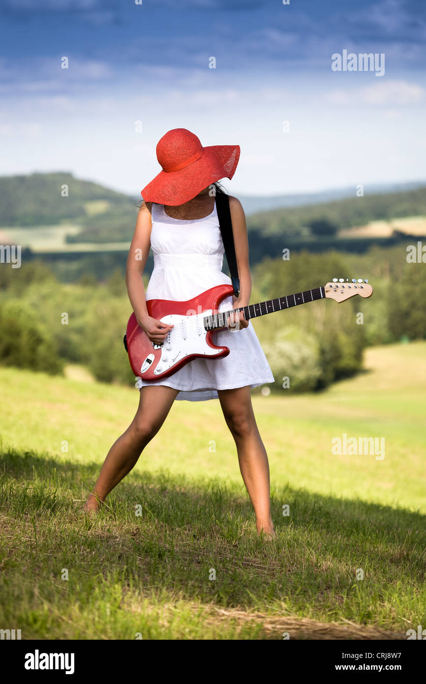 outdoor portrait of young woman with a guitar Stock Photo - Alamy