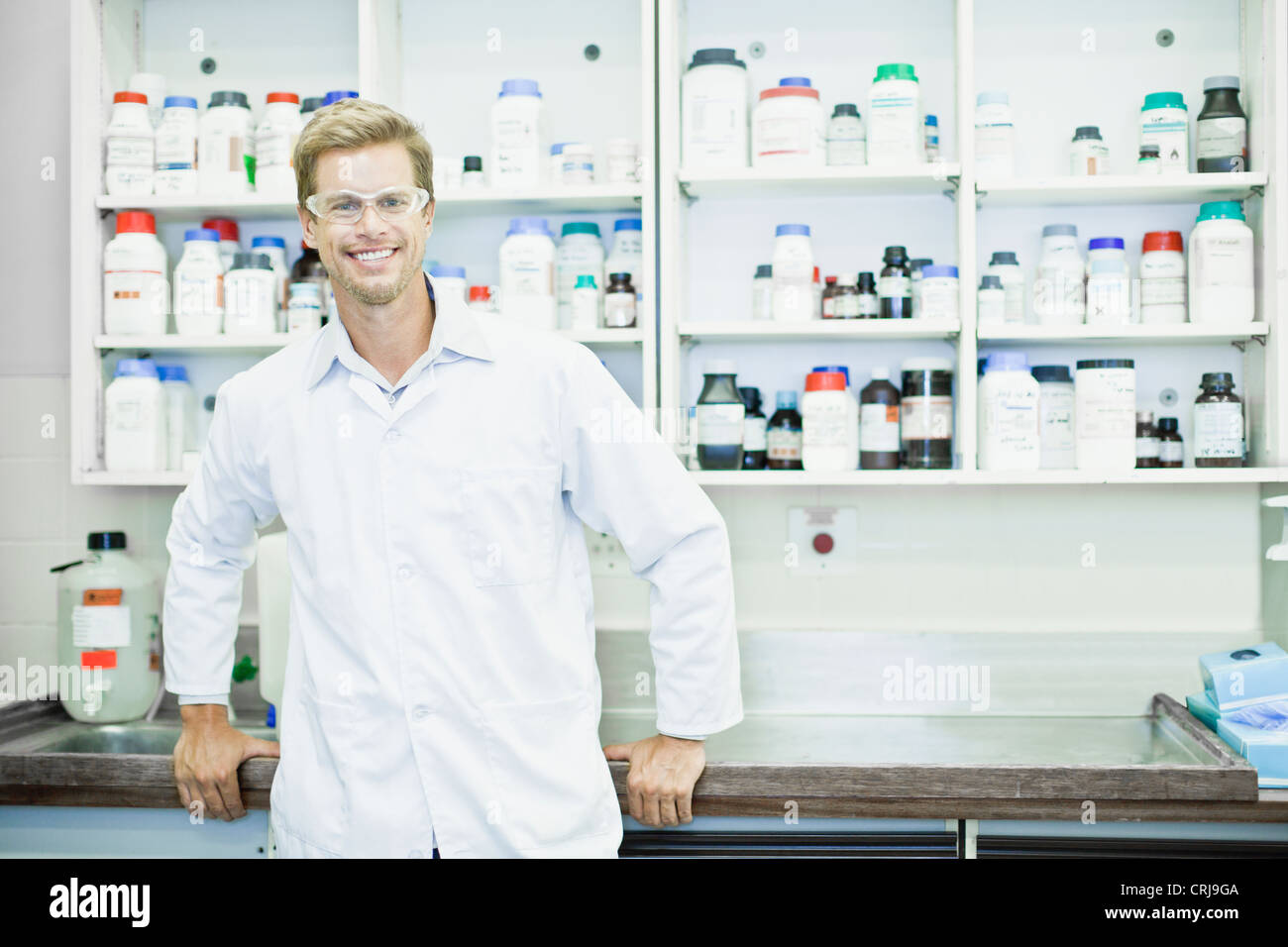 Scientist wearing goggles in lab Stock Photo Alamy