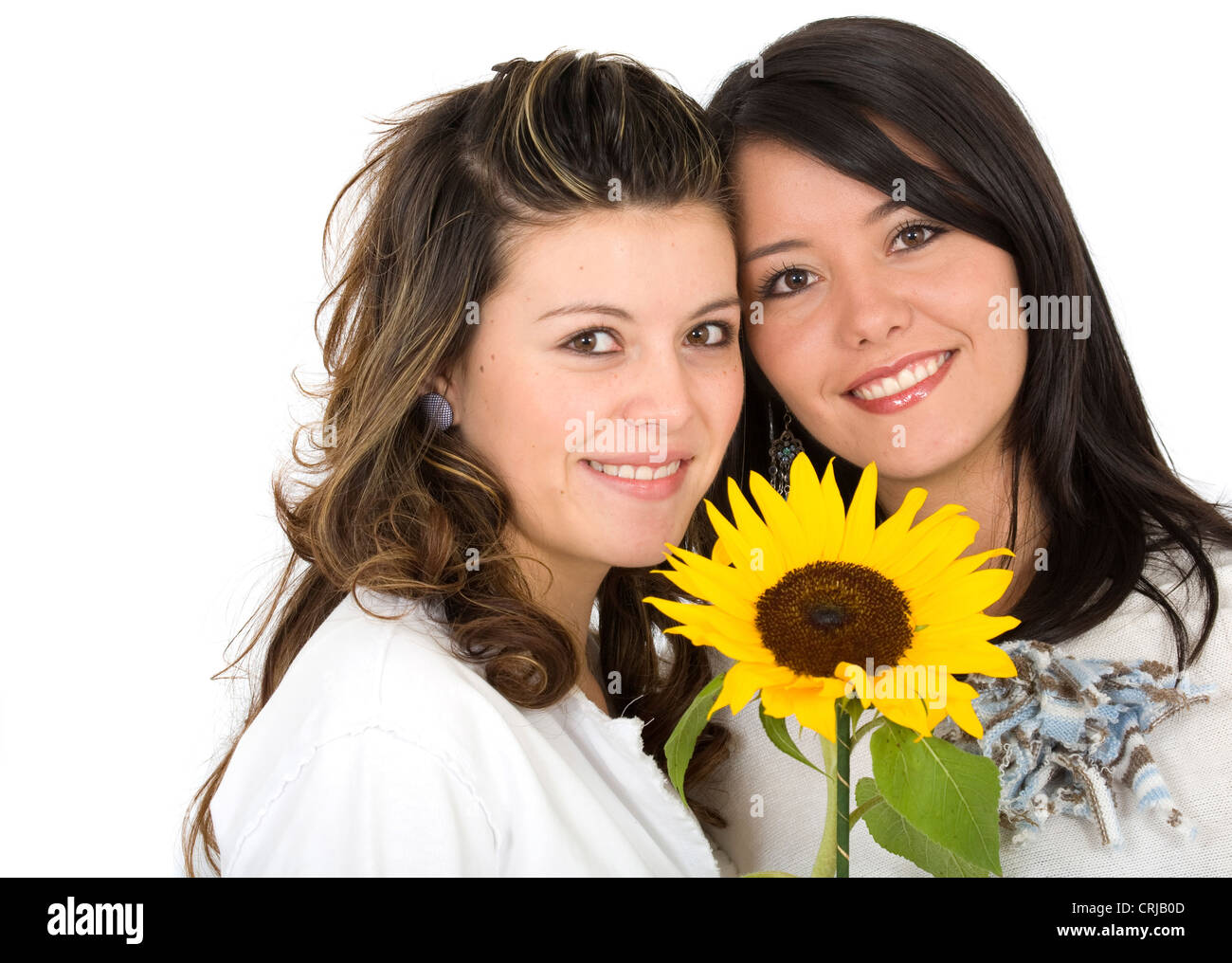 beautiful sisters portrait with a sunflower Stock Photo
