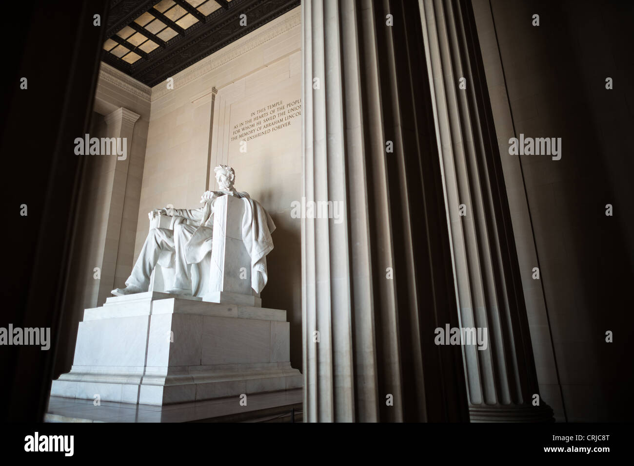 WASHINGTON DC, USA - Lincoln Memorial Statue and Columns. The statue of a seated President Abraham Lincoln that is the centerpiece of the Lincoln Memorial in Washington DC. It is 19 feet high and carved in Georgia white marble. A seated Lincoln looks out towards the Reflecting Pool, Washington Monument, and towards the US Capitol Building at the other end of the National Mall. Stock Photo