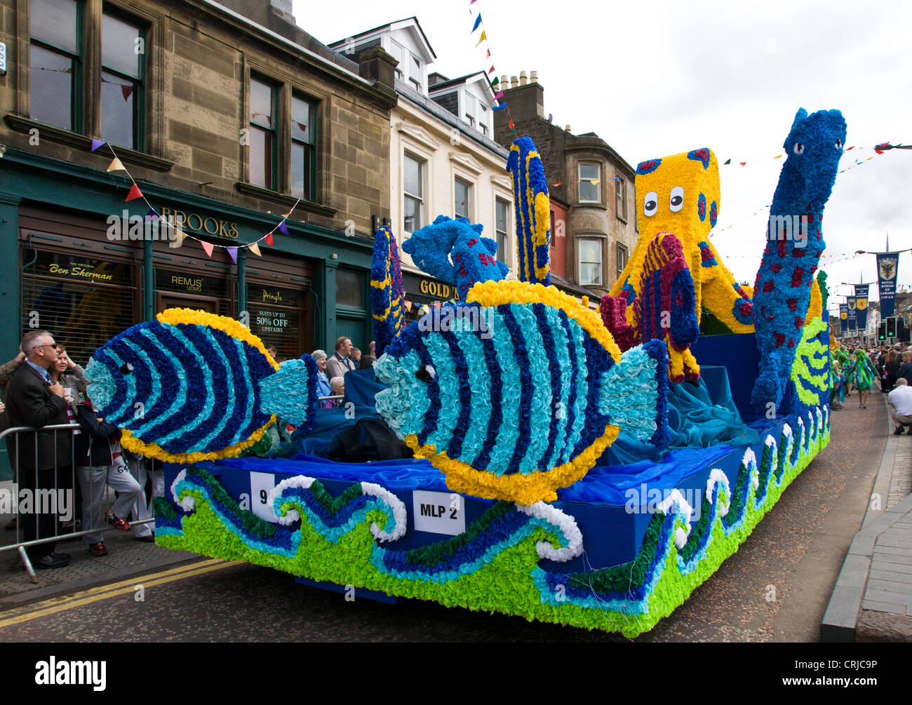 Floats or 'lorries' in the procession through the streets of Lanark on Lanimer Day  which takes place there in June of each year Stock Photo