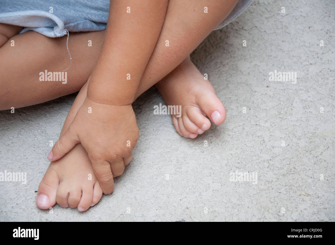 Child feet and hand Stock Photo Alamy