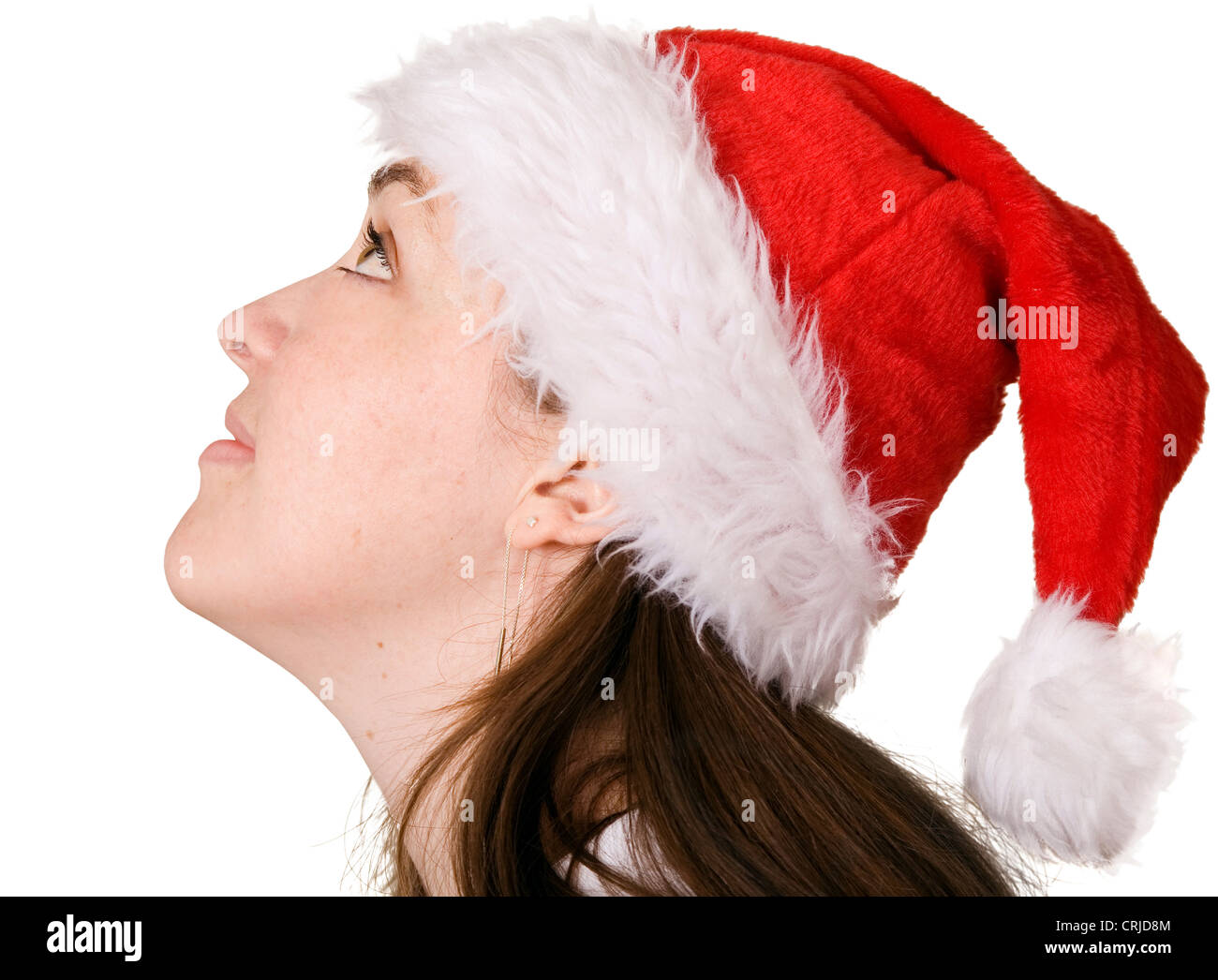 beautiful girl wearing a christmas hat looking up Stock Photo