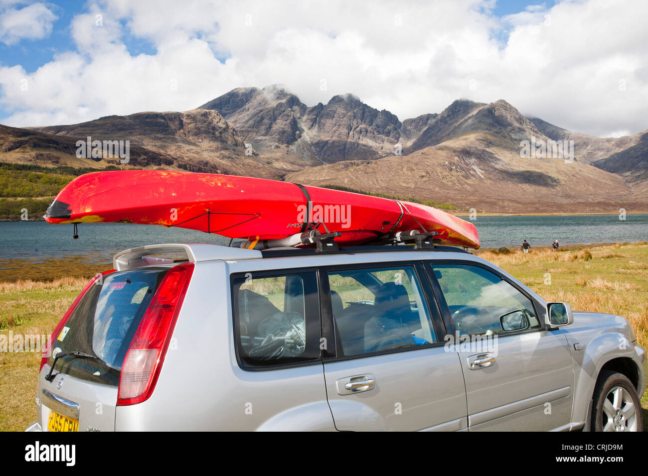 Blaven an outlier of the Cuillin Ridge on the Isle of Skye, Scotland, UK, from Torrin, with a car and canoe by Loch Slappin. Stock Photo