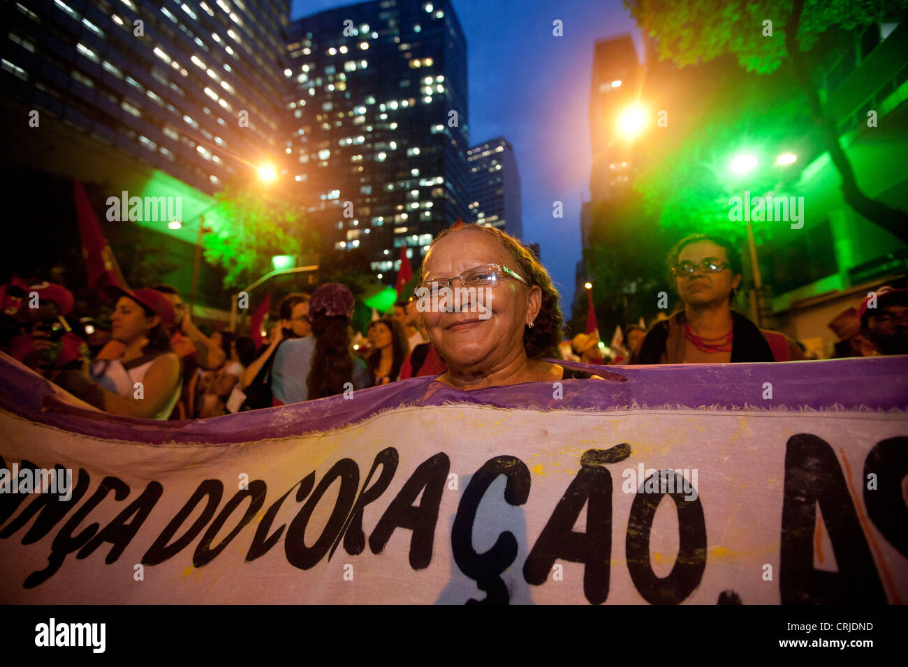 People's Summit at Rio+20 for Social and Environmental Justice Senior woman protesting with good humor ( coração means 'heart' ) Stock Photo