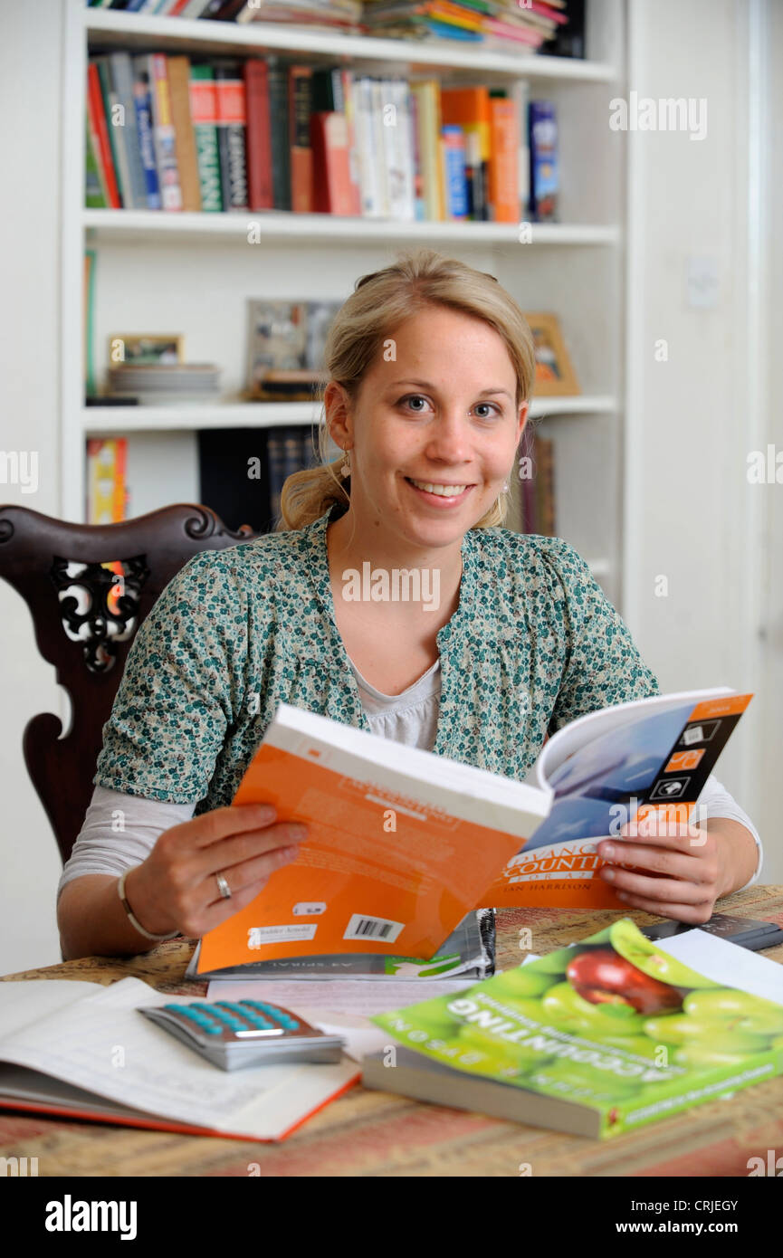 A female accountancy student being privately tutored to help with exams UK Stock Photo