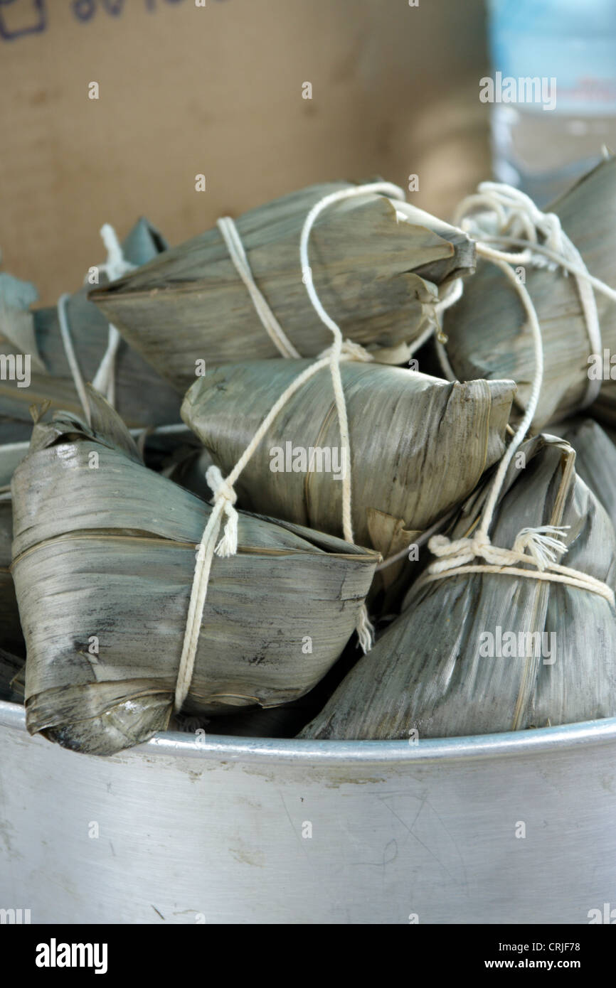 Chinese rice dumplings wrapped in reed leaves Stock Photo - Alamy