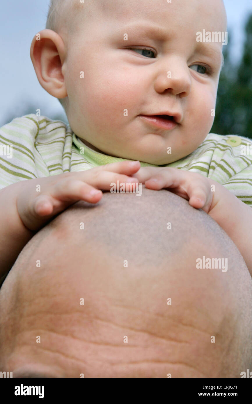 father carrying his child on the shoulders, Germany Stock Photo