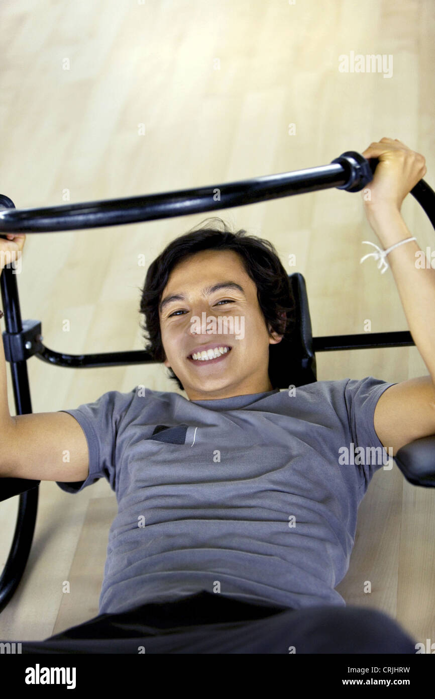 young man working out on an abs machines Stock Photo Alamy