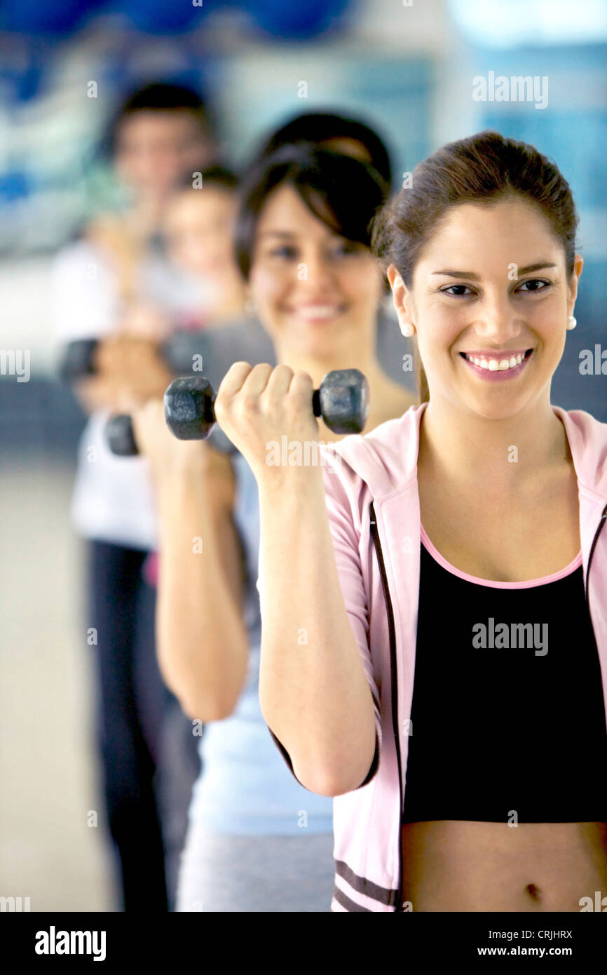 woman holding free weights at the gym Stock Photo Alamy