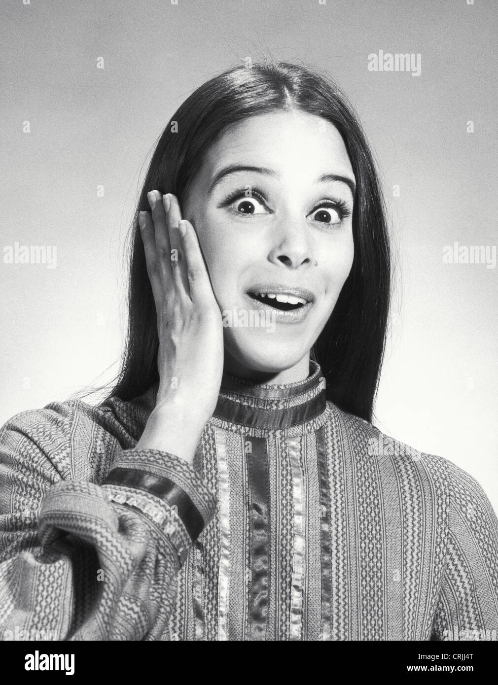 Young woman looking surprised Stock Photo