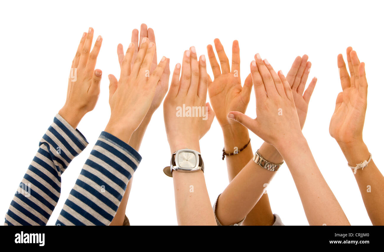 eight hands raised into the air together Stock Photo