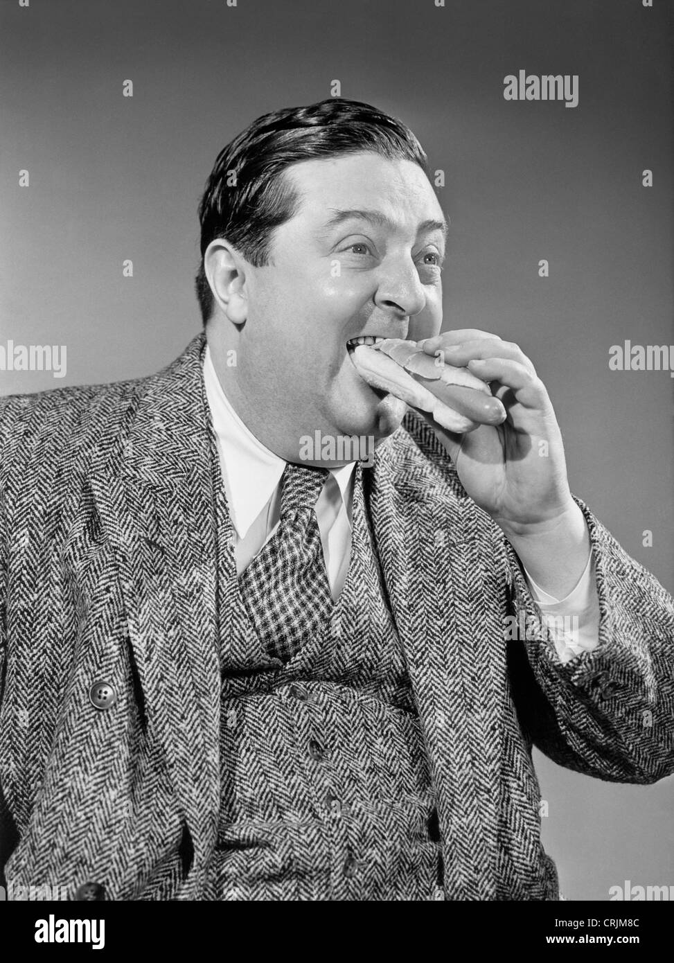 Man eating hotdog Stock Photo