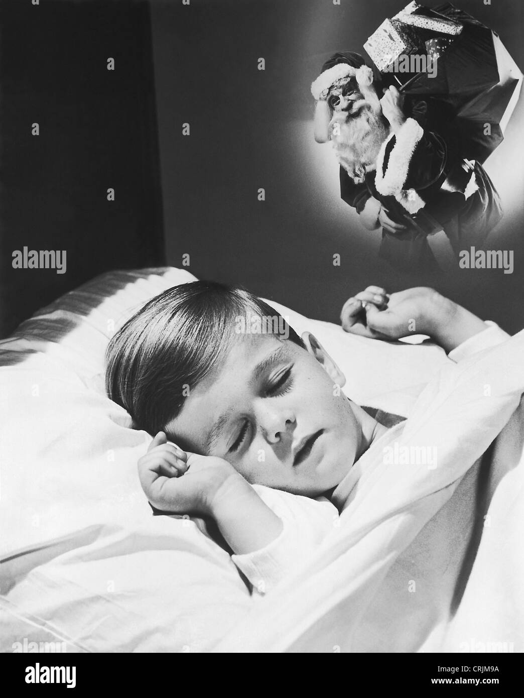 Boy dreaming of Santa Claus Stock Photo - Alamy