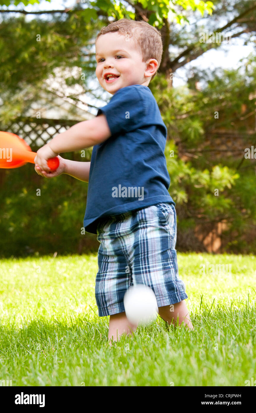 Two and a half year old boy playing baseball in his backyard, Cincinnati,  Ohio Stock Photo - Alamy