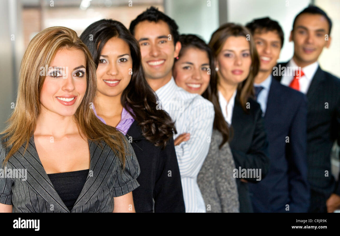 Business team full of young entrepreneurs with a beautiful girl leading Stock Photo