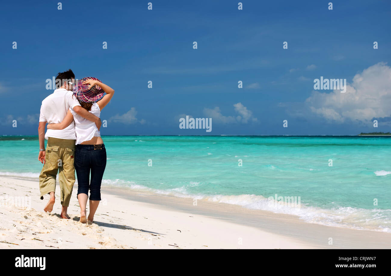 couple in love walking at the sea Stock Photo