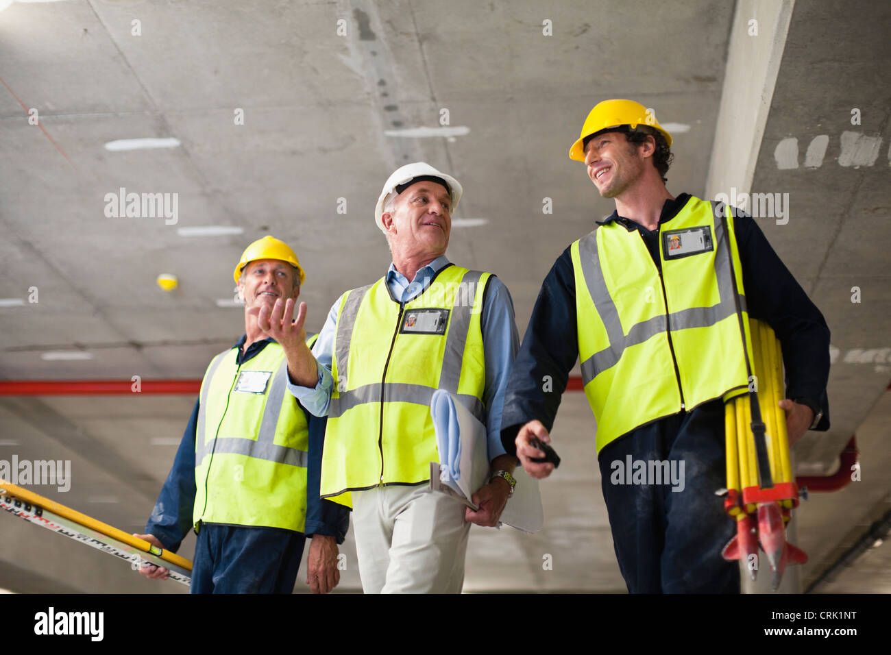 Workers walking at construction site Stock Photo Alamy