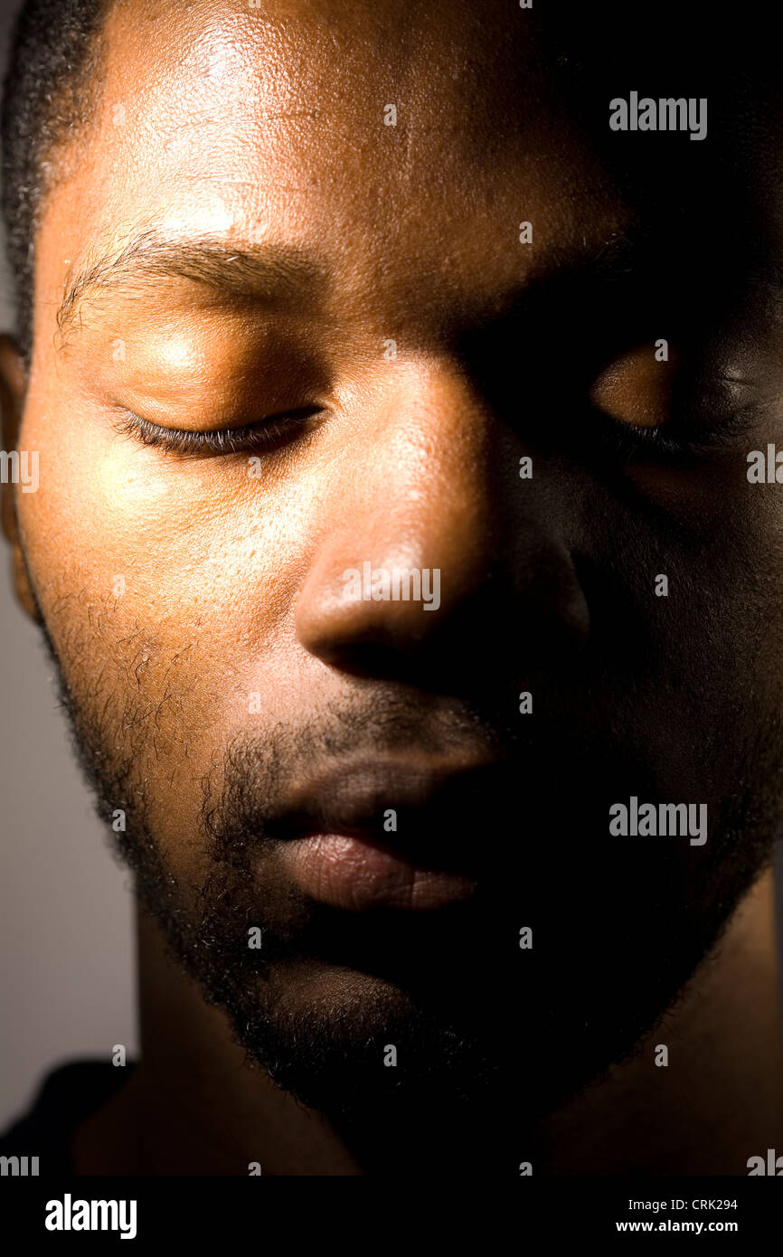 Black guy with top one eye closed
