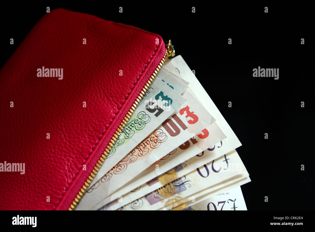 Sterling notes in a lady's pink purse Stock Photo - Alamy