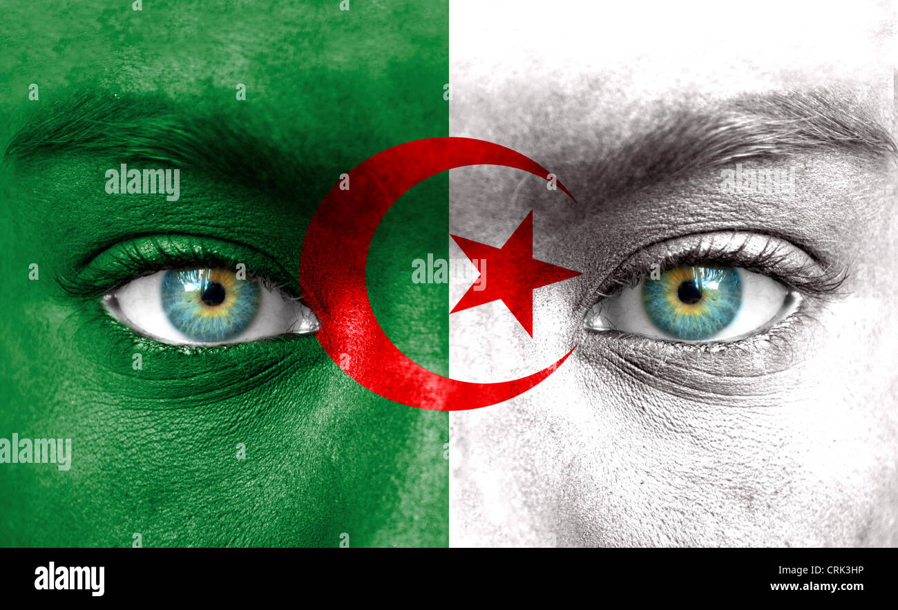 Human face painted with flag of Algeria Stock Photo