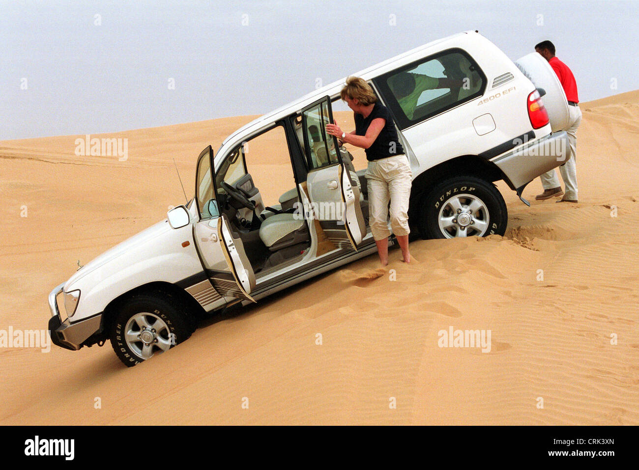 A Jeep has gotten stuck in the desert of Dubai Stock Photo