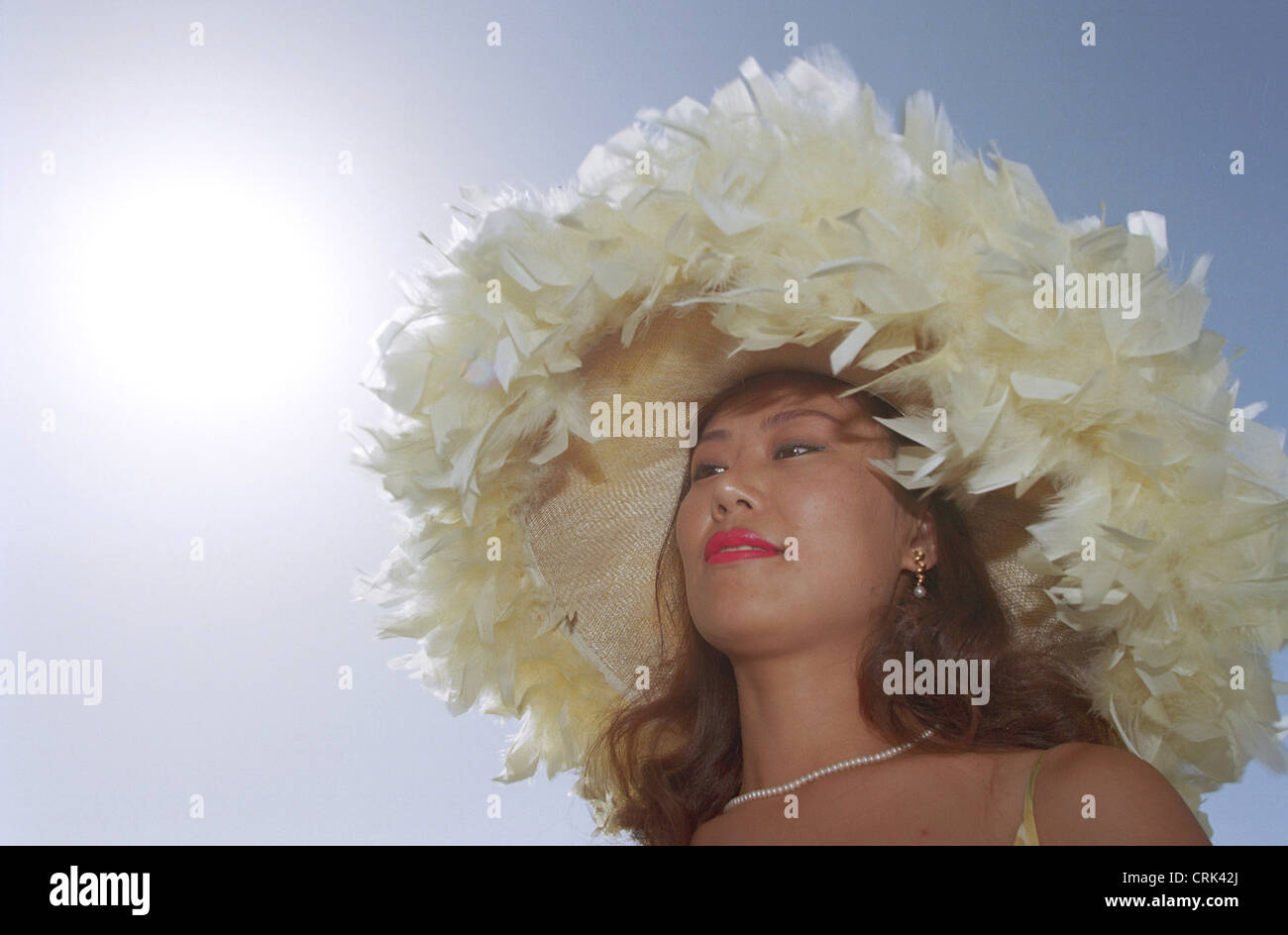 Woman with fancy hat in Dubai Stock Photo Alamy