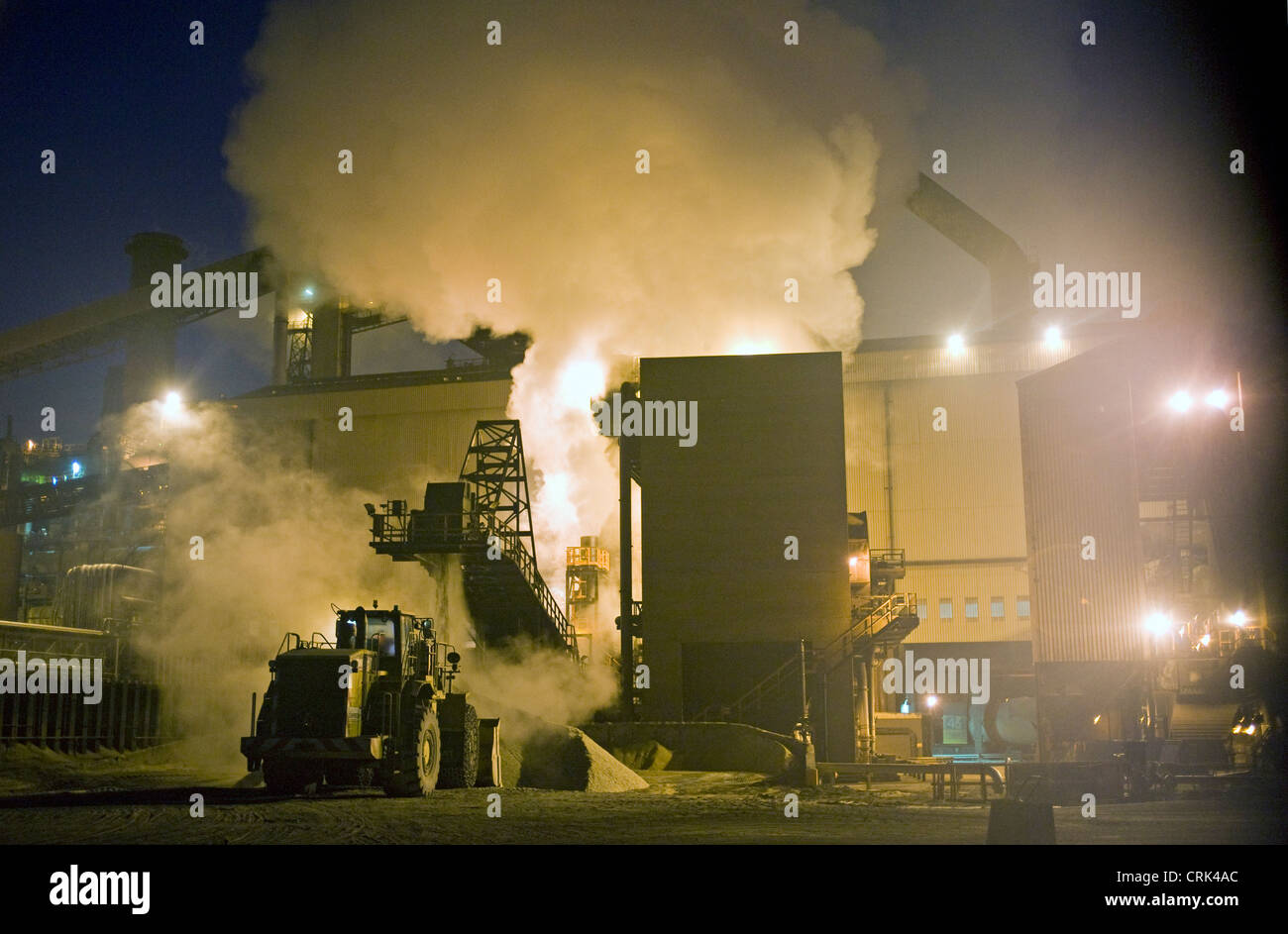 Excavator shoveling ash at Redcar blast furnace Stock Photo Alamy