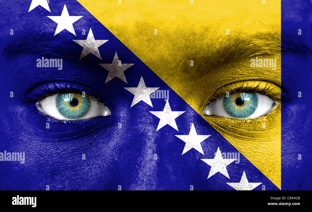 Human face painted with flag of Bosnia and Herzegovina Stock Photo