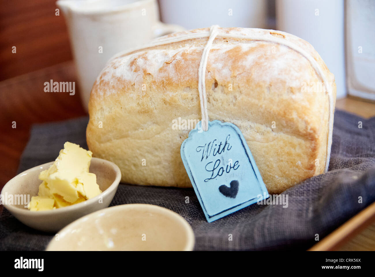 Loaf of bread with butter on cloth Stock Photo