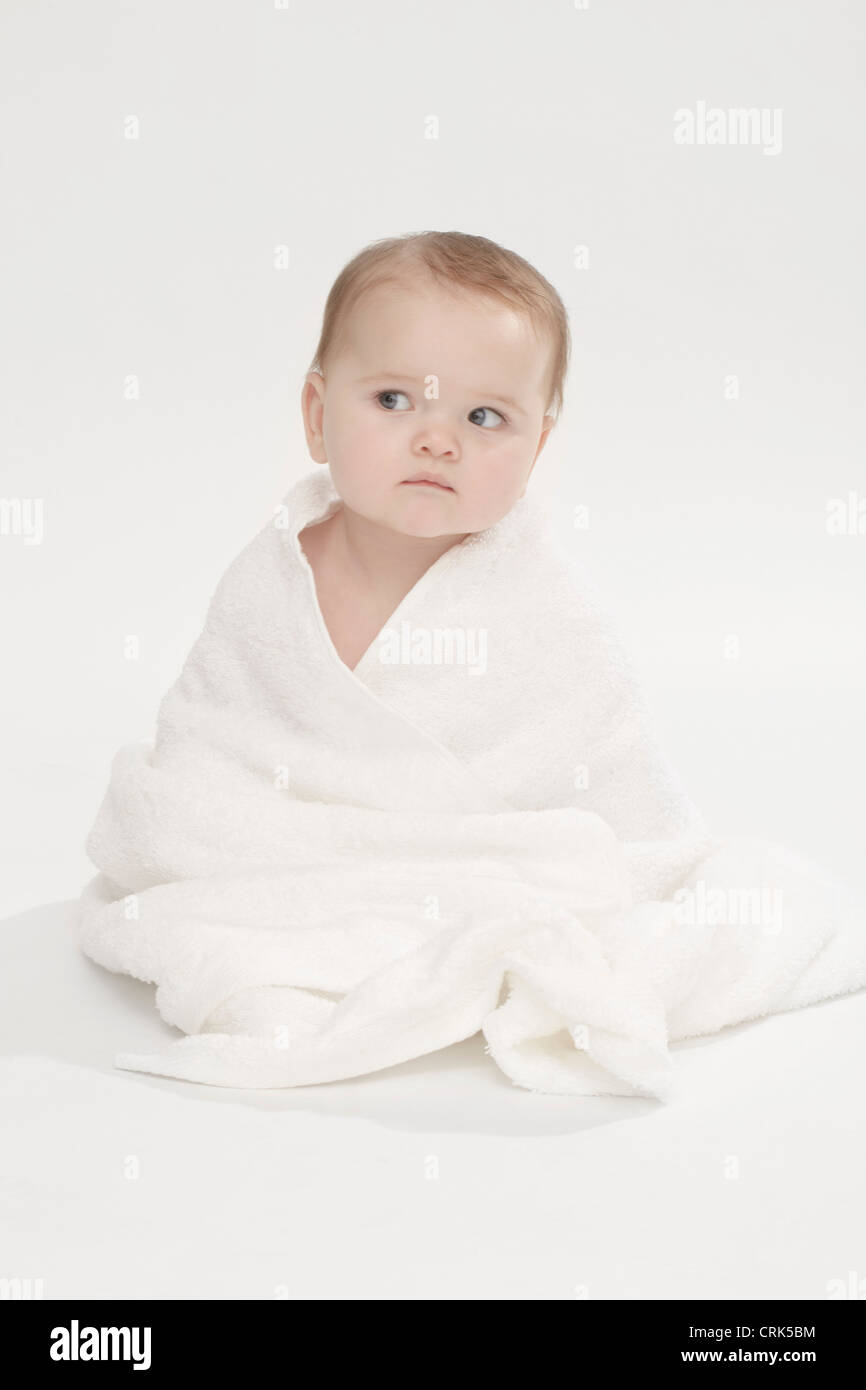 Close up of baby girl wearing bathrobe Stock Photo Alamy