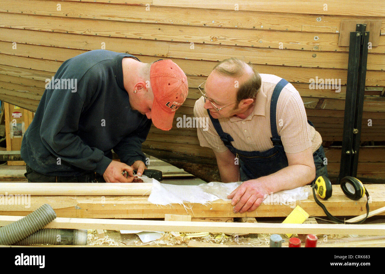 Berlin, an apprentice boat builder is instructed by his master Stock Photo